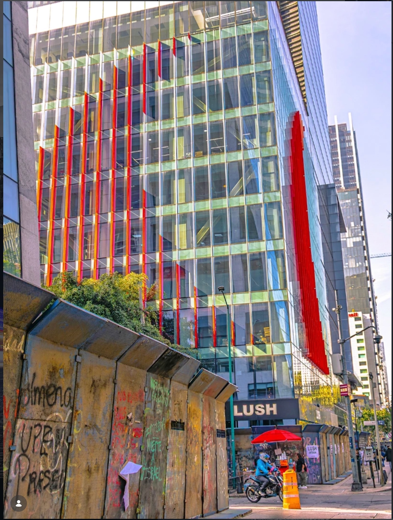 Modern glass building with colorful facade details
